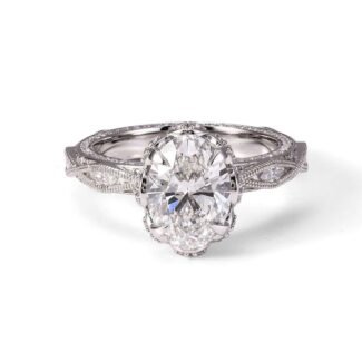 Vintage-Inspired Oval Cut Diamond Ring with Intricate Filigree Design